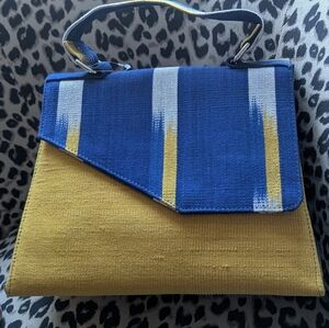 FemFaso handbag featuring a distinctive African-inspired fabric pattern Yellow